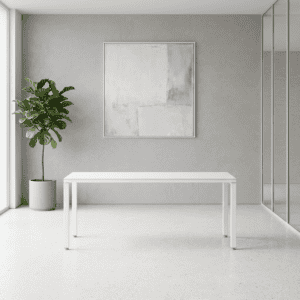 Mesa blanca minimalista en espacio moderno con planta y arte abstracto en pared.