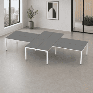 Mesa de oficina modular con superficie gris y estructura blanca.